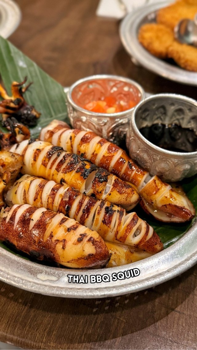 Perfectly grilled tender squid! With tomato and onion + spicy soy sauce on the side. Sarap 🤤