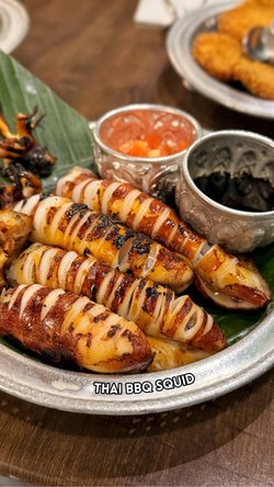 Perfectly grilled tender squid! With tomato and onion + spicy soy sauce on the side. Sarap 🤤